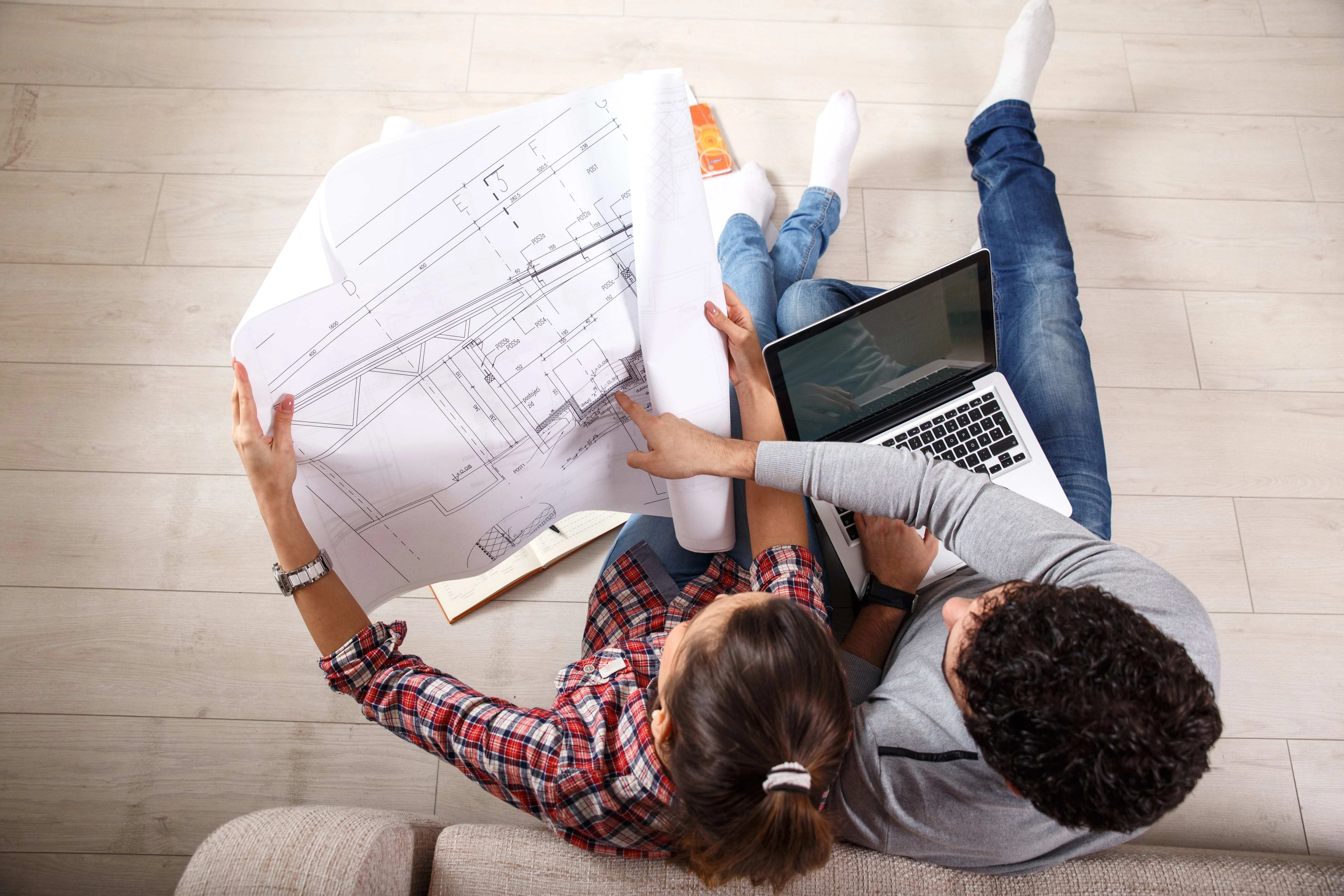 Couple reading new house plans